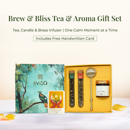 JiViSa Brew &amp; Bliss Tea &amp; Aroma Gift Set featuring two herbal tea blends glass tubes-Tulsi and Mountain blend, a brass infuser, Cozy Vanilla candle glass jar, and a glow affirmation card. All items are arranged in a yellow tray beside its green nature-inspired gift box with bird and foliage illustration. Top text reads: “Brew &amp; Bliss Tea &amp; Aroma Gift Set” followed by: “Tea, Candle &amp; Brass Infuser | One Calm Moment at a Time.” Highlighted badge reads: “Includes Free Handwritten Card.”
