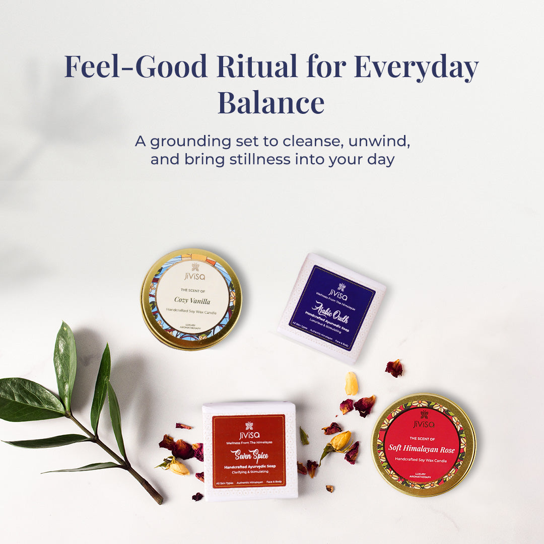 Tagline reads: &quot;Feel-Good Ritual for Everyday Balance&quot; followed by text describing Himalayan Rituals Soap &amp; Candle Gift Box as a grounding set to cleanse, unwind, and bring stillness into your day. A flat lay composition of the gift set items – two Ayurvedic soaps (Seven Spice and Arabic Oudh) and two aromatic soy wax candles (Royal Oudh and Soft Himalayan Rose) – styled with leaves and dried flower petals. Each item is labeled and color-coded, creating a sense of calm, balance, and harmony.