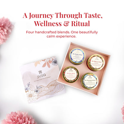 Text on the image reads:&quot;A Journey Through Taste, Wellness &amp; Ritual – Four handcrafted blends. One beautifully calm experience.&quot; The open gift box is displayed from a top angle, containing four labeled JiViSa handmade herbal tea tins. The soft pink background and floral accents create a calming and luxurious visual atmosphere, perfect for wellness rituals.
