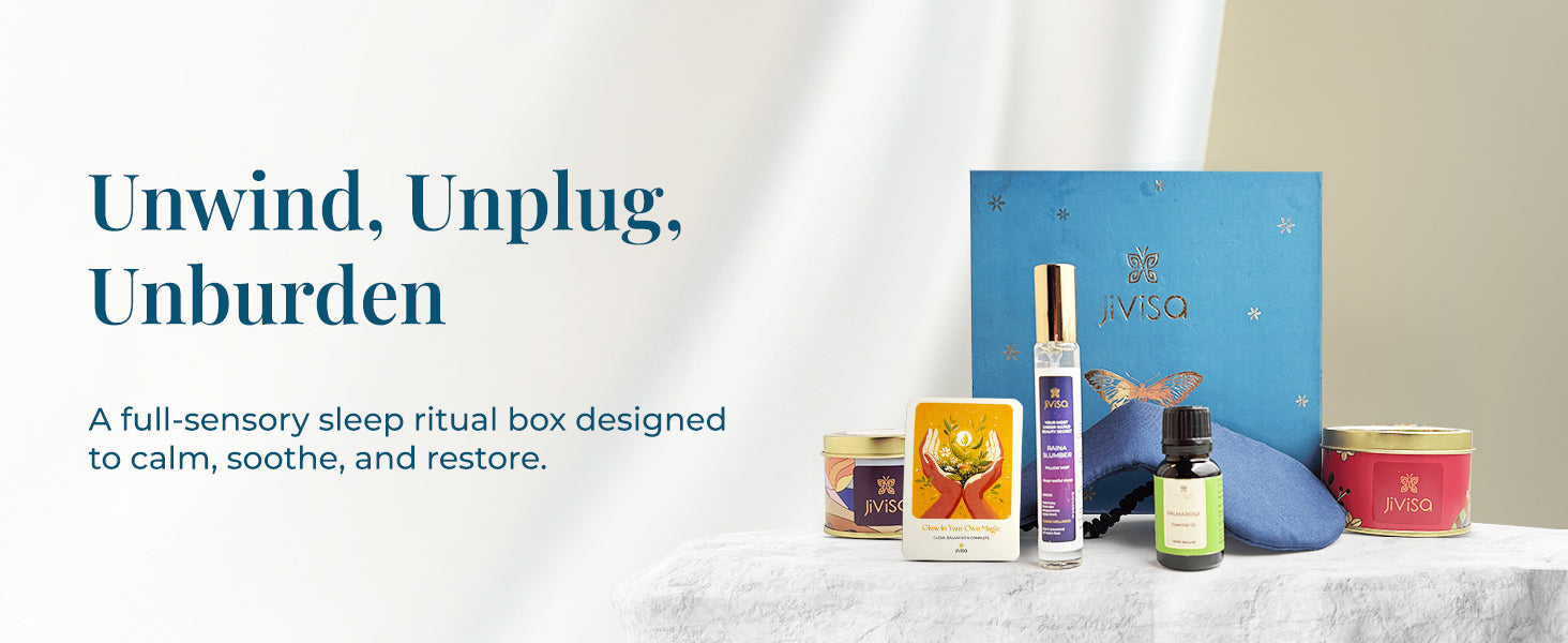 JiViSa Dreamscape Relaxation Aroma Gift Set elegant blue box contains JiViSa Herbal Tea Blend, JiViSa Premium Soy Wax Candle, JiViSa Palmarosa Essential Oil, JiViSa Raina Slumber Pillow Mist, and a soft blue eye mask paired with a handwritten illustrated gift card. Tagline reads: "Unwind, Unplug, Unburden." Supporting text: A full-sensory sleep ritual box designed to calm, soothe, and restore.