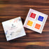 JiViSa-Ayurvedic Glow Soap Gift Box with four handcrafted soaps in floral-themed packaging, displayed on a wooden surface. JiViSa-Ayurvedic Glow Soap Gift Box contains Seven Spice Ayurvedic Soap – a revitalizing blend inspired by ancient Indian spice therapy, Arabic Oudh Ayurvedic Soap – a deep, aromatic experience with warm, woody notes, Coconut & Honey Ayurvedic Soap– nourishes and softens skin, Almond Milk & Saffron Ayurvedic Soap– a skin-brightening and soothing bar enriched with royal Ayurvedic herbs