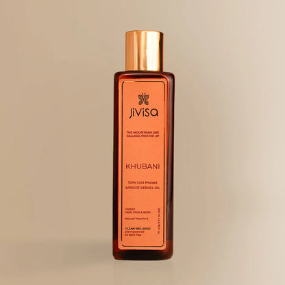 JiViSa Khubani Apricot Kernel Oil 200ML bottle with gold cap on beige background.