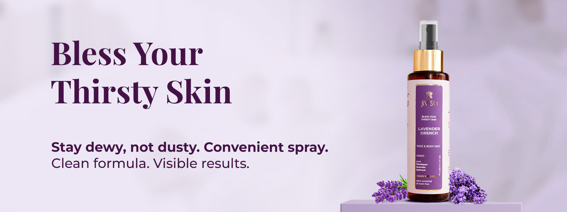 JiViSa Lavender Drench face and body mist bottle beside lavender with text about dewy skin and clean formula.