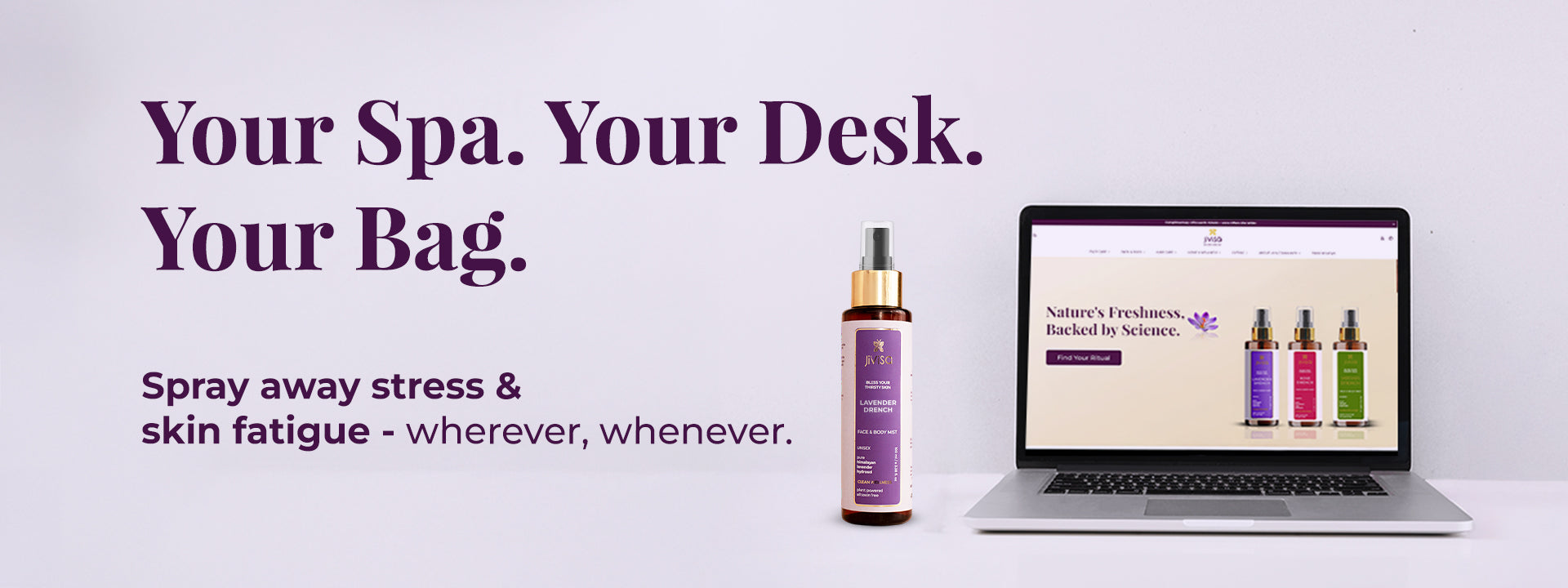  Image featuring a JiViSa Lavender Drench face & body mist spray bottle next to an open laptop displaying the JiViSa's website. Tagline reads: Your Spa. Your Desk. Your Bag, below it text highlight Spray away stress & skin fatigue – wherever, whenever. 