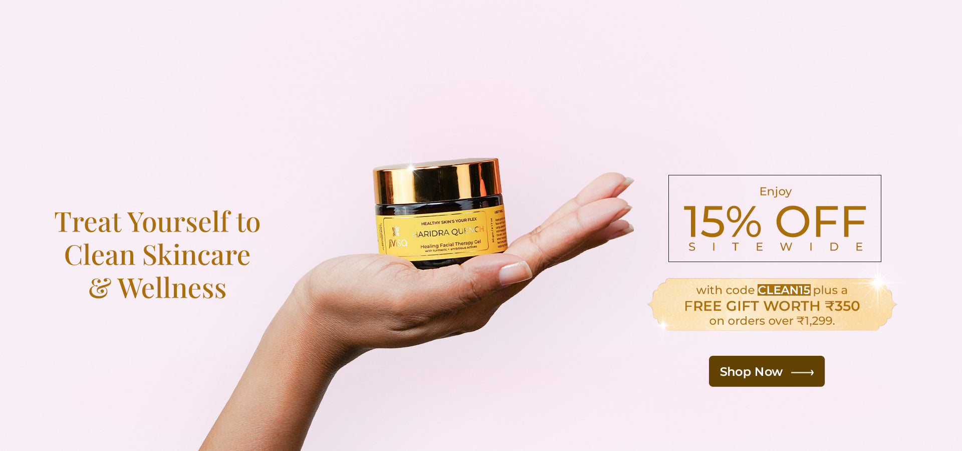 JiViSa Haridra Quench Healing Facial Therapy Gel held gracefully in hand against a soft pink background. The banner reads “Treat Yourself to Clean Skincare & Wellness,” offering 15% OFF sitewide with code CLEAN15 and a free gift worth ₹350 on orders above ₹1,299. A “Shop Now” button encourages customers to explore JiViSa’s clean beauty range.