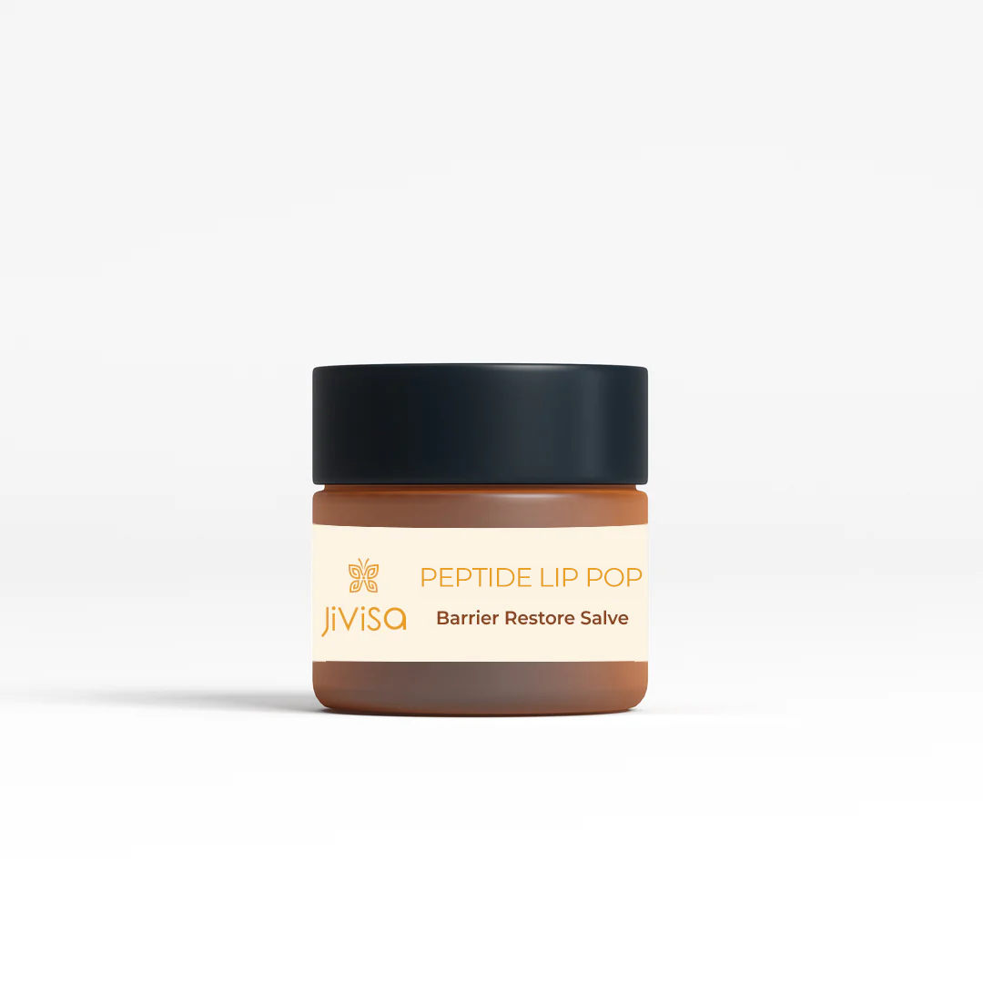 Front view of JiViSa Bourbon Vanilla Peptide Lip Lop lip balm jar. The label showcases the JiViSa logo at the top, followed by the product name 'PEPTIDE LIP LOP' and the description 'Barrier Restore Salve.' The jar has a sleek design with a black lid, emphasizing the luxurious feel of the product, designed to restore and protect the lip barrier.