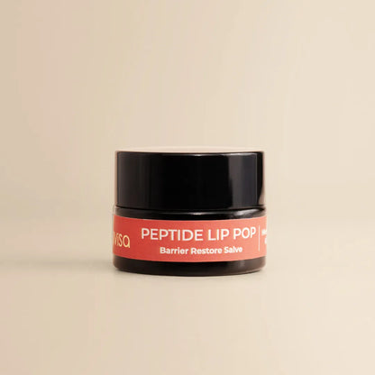 JiViSa Peptide Lip Pop Salve Himalayan Rose &amp; Lavender Barrier Restore Salve jar on beige background.