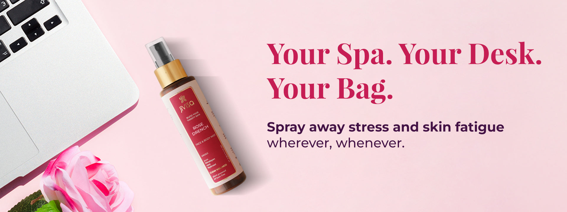 Image featuring a JiViSa Lavender Drench face & body mist spray bottle rest next to a laptop and a pink rose. Tagline reads: Your Spa. Your Desk. Your Bag, below it text highlight Spray away stress & skin fatigue – wherever, whenever.
