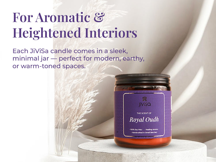 JiViSa Royal Oudh Soy Wax Candle placed on a stone pedestal with pampas grass in the background. Tagline at the top reads: “For Aromatic & Heightened Interiors.” Body text reads: “Each JiViSa candle comes in a sleek, minimal jar — perfect for modern, earthy, or warm-toned spaces.” Candle label reads: “JiViSa – The Scent of Royal Oudh – 100% Soy Wax • Healing Aroma • Handcrafted in Small Batches.”
