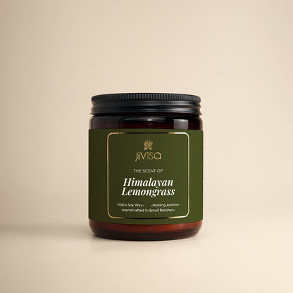 JiViSa Himalayan Lemongrass Handcrafted Soy Wax Candle 180gm in an amber glass jar with a Black tin and green label. The label reads: &quot;JiViSa Wellness From The Himalayas, THE SCENT OF Himalayan Lemongrass, Handcrafted 100% Soy Wax Candle, Healing Aroma&quot;.