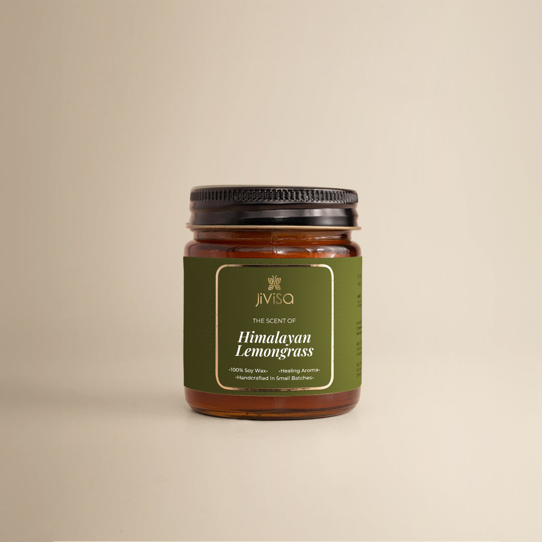JiViSa Himalayan Lemongrass Handcrafted Soy Wax Candle 90gm in an amber glass jar with a Black tin and green label. The label reads: &quot;JiViSa Wellness From The Himalayas, THE SCENT OF Himalayan Lemongrass, Handcrafted 100% Soy Wax Candle, Healing Aroma&quot;.