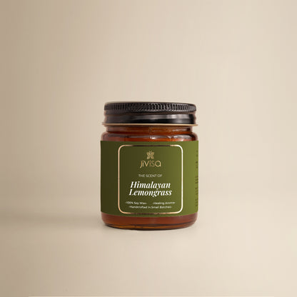 JiViSa Himalayan Lemongrass Handcrafted Soy Wax Candle 90gm in an amber glass jar with a Black tin and green label. The label reads: &quot;JiViSa Wellness From The Himalayas, THE SCENT OF Himalayan Lemongrass, Handcrafted 100% Soy Wax Candle, Healing Aroma&quot;.