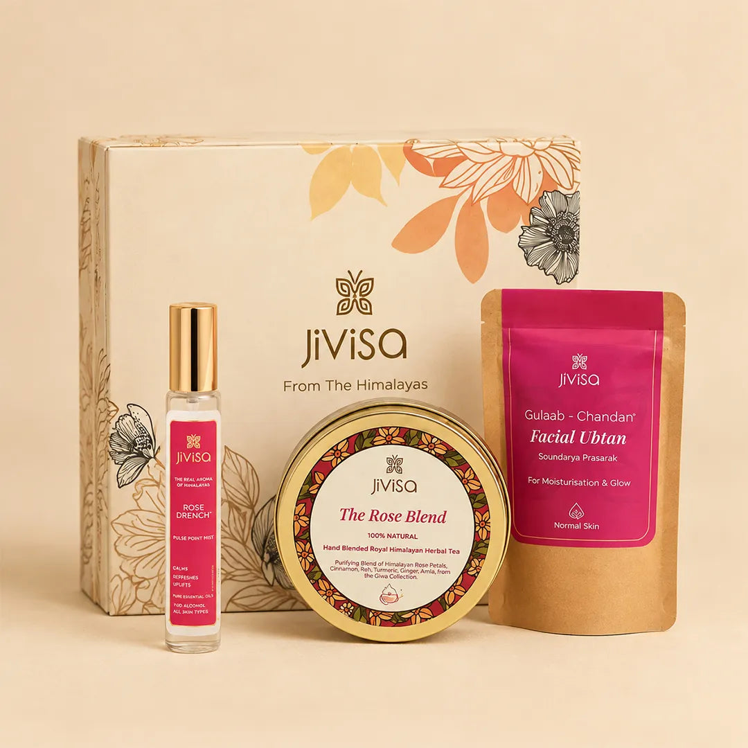 JiViSa Himalayan Skin Essentials Gift Box displayed with Rose Drench Face Mist, Gulab-Chandan Facial Ubtan, and The Rose Blend Himalayan herbal tea in a floral gift box.