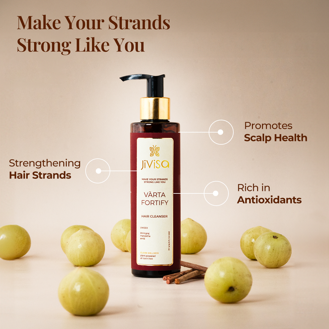 A bottle of JiViSa's Varta Fortify hair cleanser with the text " Make Your Strands Syrong Like You". The Benifits highlighted include Strengthening hair strands promotes scalp health and rich in antioxidants.