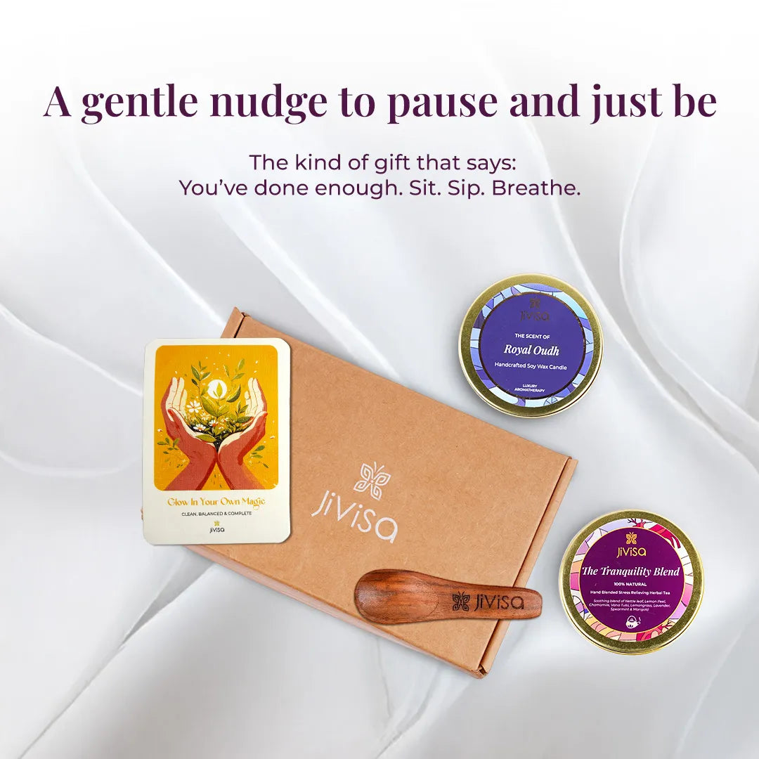 JiViSa Tranquil Himalayan Tea and Candle Gift Box with Royal Oudh candle, Tranquility Blend tea, wooden spoon, and handwritten message card on white fabric