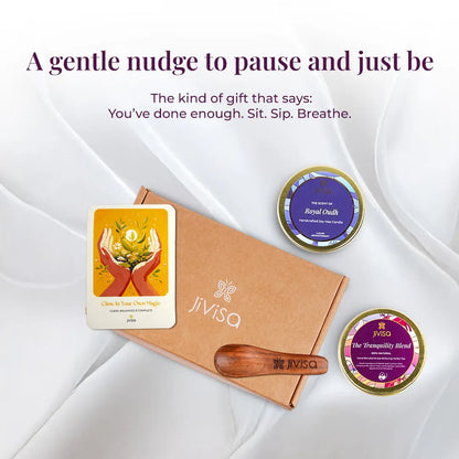 JiViSa Tranquil Himalayan Tea and Candle Gift Box with Royal Oudh candle, Tranquility Blend tea, wooden spoon, and handwritten message card on white fabric