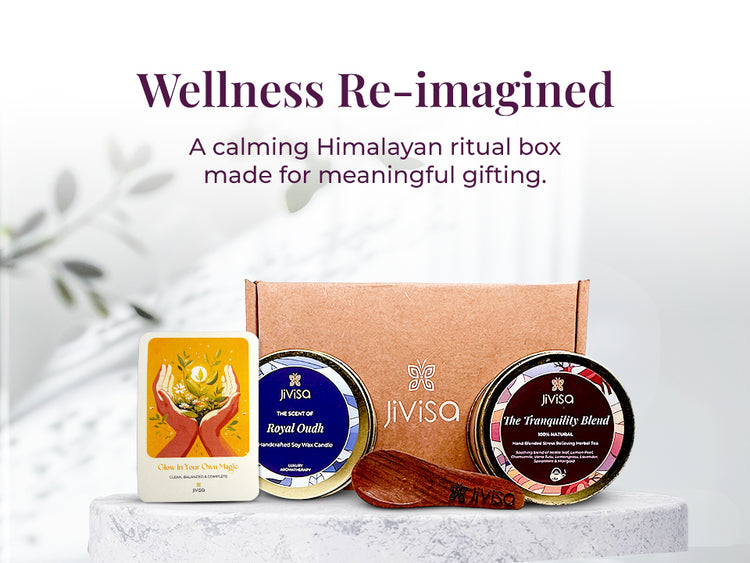 JiViSa Tranquil Himalayan Gift Box featuring Royal Oudh soy wax candle, The Tranquility Blend herbal tea, a wooden spoon, and an affirmation card, arranged in front of a kraft box. Tagline above reads: “Wellness Re-imagined”, followed by subtext: 'A calming Himalayan ritual box made for meaningful gifting.'
