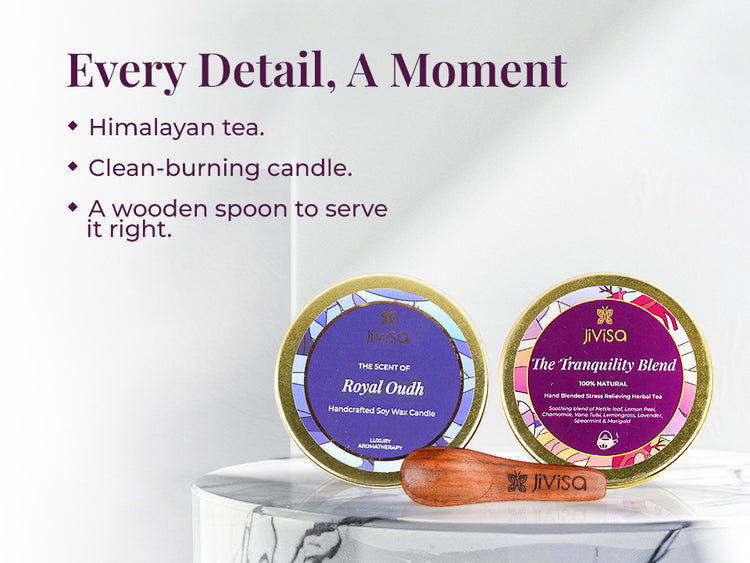 JiViSa Royal Oudh handcrafted soy wax candle and JiViSa The Tranquility Blend herbal tea tins placed side by side with a JiViSa wooden tea spoon, arranged on a white marble. Tagline on the left reads: “Every Detail, A Moment.” Bullet points list: Himalayan tea | Clean-burning candle | A wooden spoon to serve it right.
