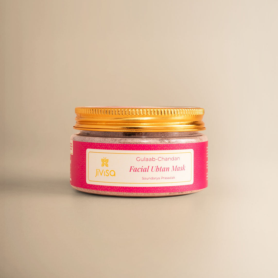 JiViSa Gulaab Chandan Facial Ubtan Mask jar with gold lid on beige background.
