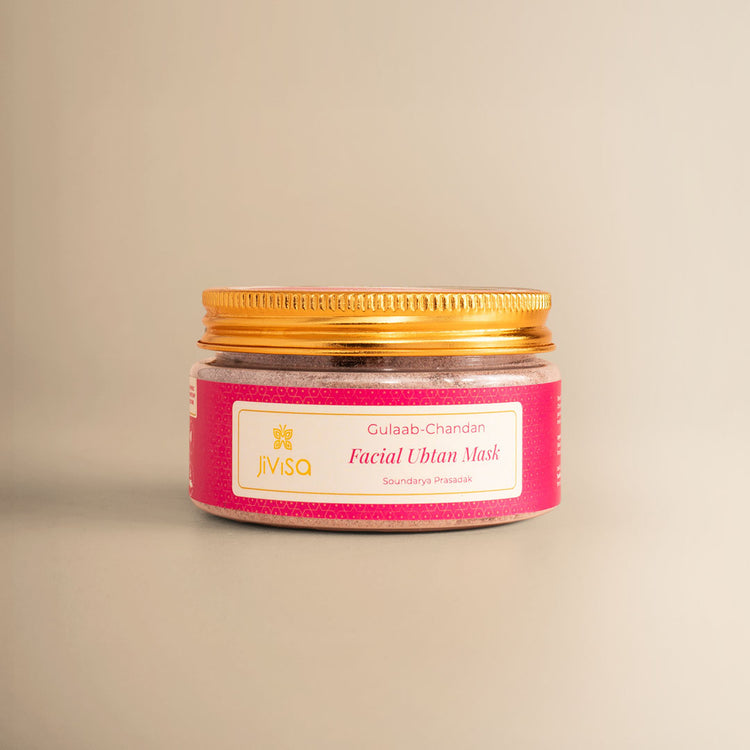 JiViSa Gulaab Chandan Facial Ubtan Mask jar with gold lid on beige background.