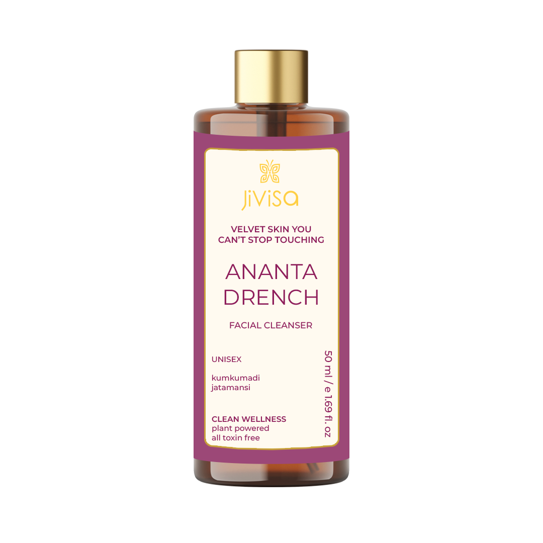 Front view of JiViSa's Ananta Drench Facial Cleanser, 50ml bottle, featuring a cream label with a purple border, the product name, and the tagline 'Velvet Skin You Can't Stop Touching', highlighting key ingredients like kumkumadi and jatamansi.