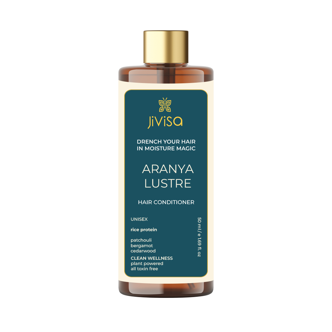 Front view of JiViSa Aranya Lustre Hair Conditioner bottle labeled with the product's name, highlighting key ingredients like rice protein, patchouli, bergamot, and cedarwood. The product promises to drench hair in moisture magic and is plant-powered and toxin-free.