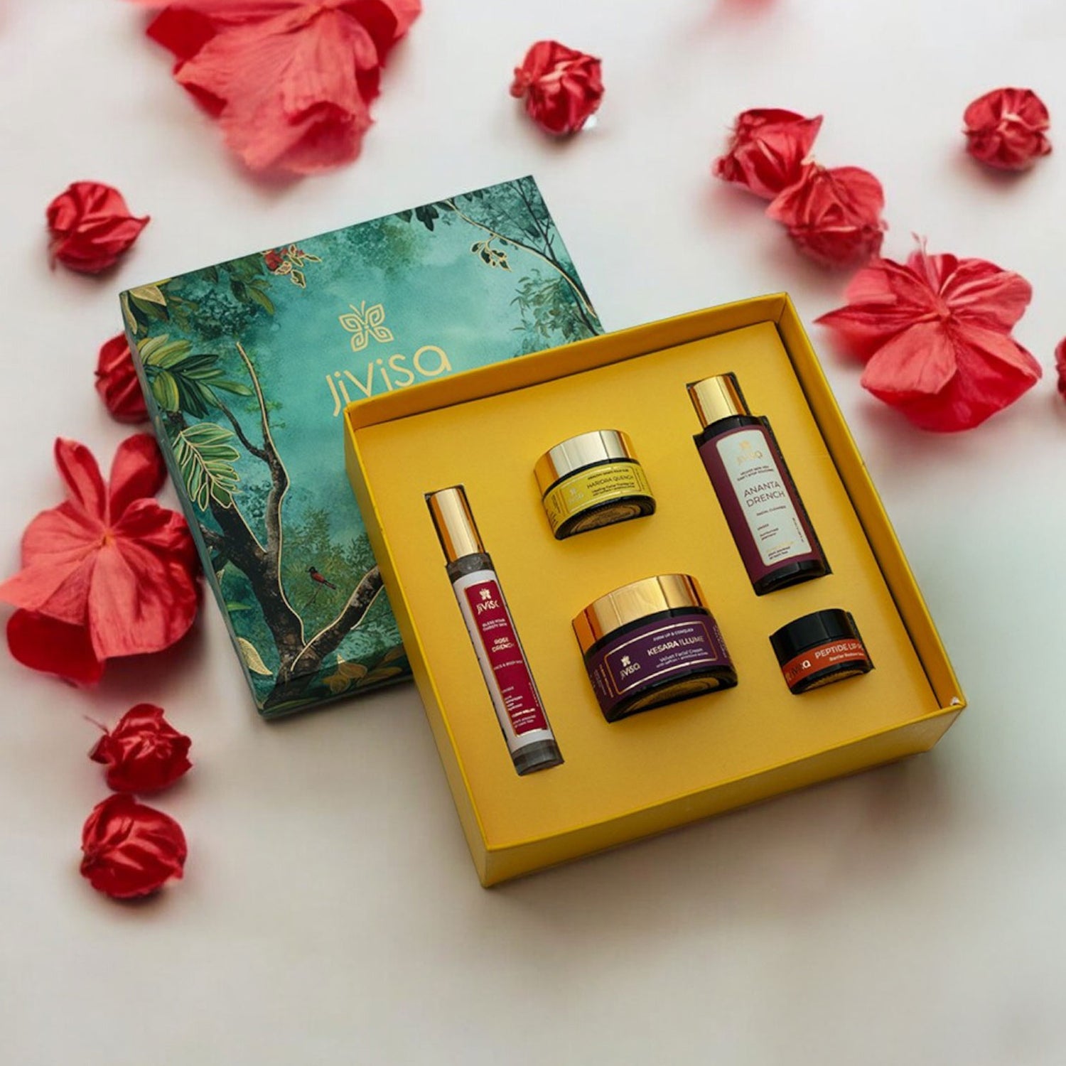 JiViSa-Himalayan Glow Ritual for Her Gift box is a beautifully curated collection of five premium wellness products designed to nourish and rejuvenate the skin. It includes the JiViSa-Ananta Drench Facial Cleanser, JiViSa-Rose Drench Face &amp; Body Mist, JiViSa- Kesara Illume Velvet Facial Creme, JiViSa- Haridra Quench Healing Facial Therapy Gel and JiViSa-Peptide Lip Pop. Elegantly packed in a vibrant, nature-inspired gift box, this set makes a perfect gift for festive occasions or a luxurious treat for her.