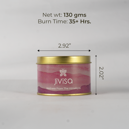 JiViSa Wellness From The Himalayas Cozy Vanilla Premium Soy Wax Candle in a gold tin with a pink and white swirl pattern. Text overlaid on the image indicates its dimensions and burn time: Net wt: 130 gms, Burn Time: 35+ Hrs, with arrows showing 2.92 width and 2.02 height.

