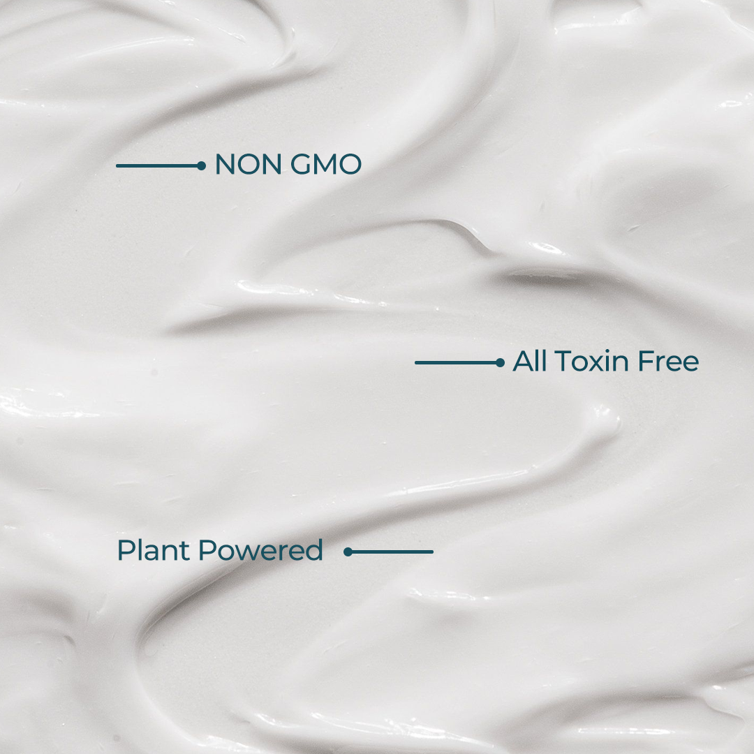 Close-up image showing the texture of Aranya Glaze buttery body milk, highlighting it is NON GMO, All Toxin free, plant powered.