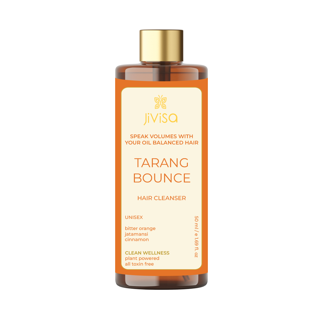 The front label of JiViSa's Tarang Bounce Hair Cleanser for 50 ml. The label presents the product name, "Tarang Bounce," with the tagline "Speak Volumes With Your Oil Balanced Hair." It indicates that the product is unisex and includes ingredients like bitter orange, jatamansi, and cinnamon. The label also notes that the product is part of the "Clean Wellness" series, which is plant-powered and free from toxins.