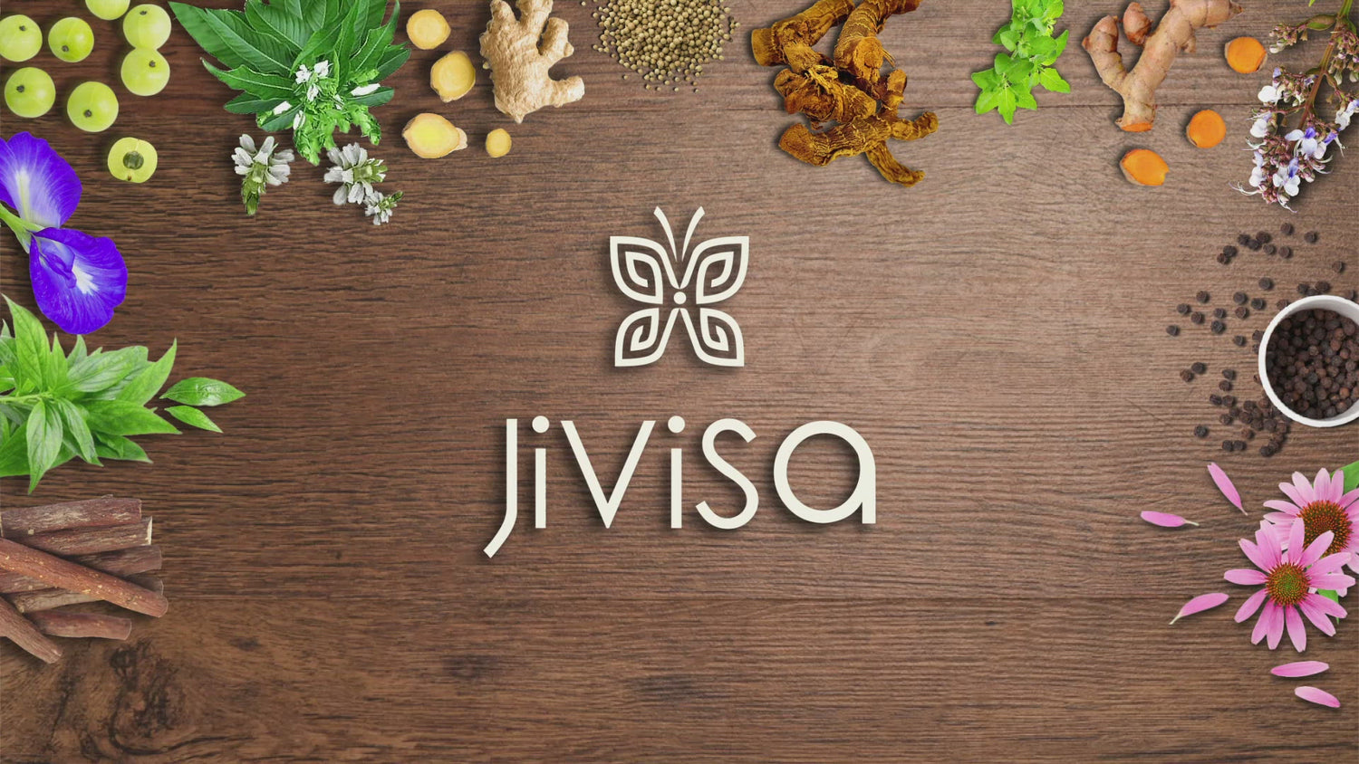 Video feature a wooden background adorned with 13 natural herbs and spices including Amla, Ginger, Curcumin, Kalmegh, Shankha Pushpi, Kulinjan, Bharangi, Holy Basil (Tulsi), Coriander seeds, Vasaka. Echinacea, Liquorice and Black pepper. Frame showcase the &quot;JiViSa-The Nectar of Life&quot; tin and a sachet with text highlighting its benefits as an &quot;IMMUNITY BOOSTING INSTANT HERBAL DRINK&quot; &amp; &quot;INFUSED WITH THE HEALING POWER OF THIRTEEN MAGICAL HERBS for your INNER STRENGTH.